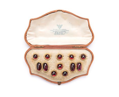 A BOX OF GOLD AND GARNET SHIRT STUDS AND CUFFLINKS, 18TH CENTURY tube set garnet cabochons designed as typical form shirt stu