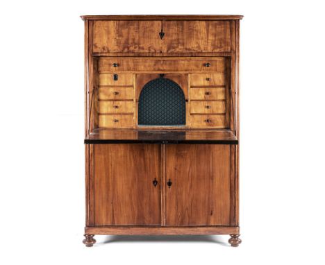 A BIEDERMEIER SECRÉTAIRE À ABATTANT the rounded rectangular top above a secrétaire drawer enclosing a compartment flanked by 