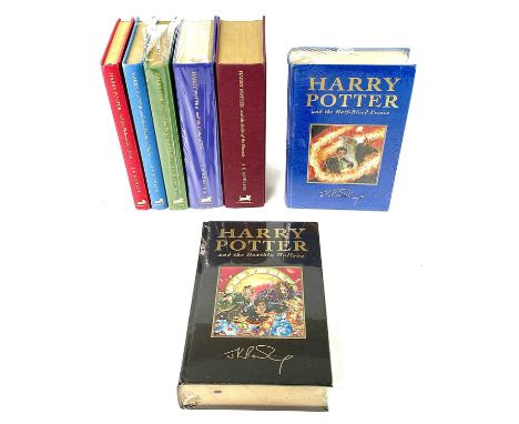 J. K. ROWLING. (b.1965 -). A Full Set of First Deluxe Edition Harry Potter Novels. Bloomsbury, 1999-2007.Seven volumes, four 