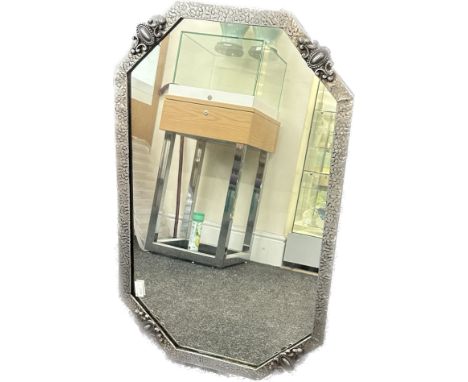 Vintage hammered pewter framed mirror measures approximately 19 inches by 31 inches 