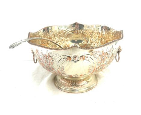 Large antique silver on copper lion handled punch bowl and ladle measures approximately 8 inches tall 13 inches diameter 