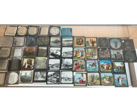 Large selection of vintage magic lantern slides in a wooden box 