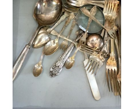 A mixed collection of sterling silver and silver-plate items to include various sterling silver flatware, four forks, three s
