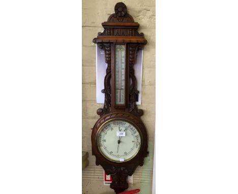 An early 20th Century oak cased banjo barometer/thermometer.