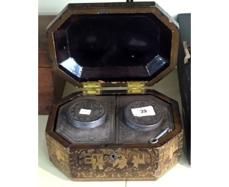 A English Victorian gilt lacquered tea caddy of shaped rectangular form, decorated with oriental figures and scenes the hinge