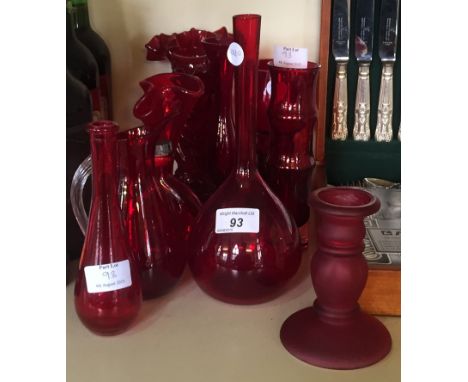 A large collection of cranberry glassware items to include vases and glasses etc.