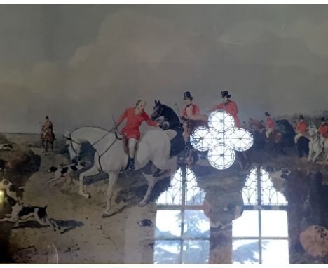 A pair of classical prints each depicting fox hunting scenes, each inset in ornate gilt frames.