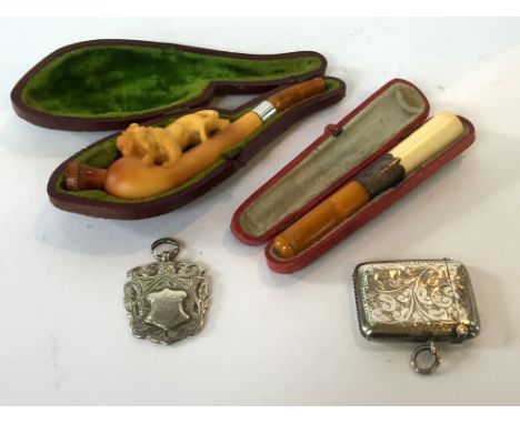 A cased meerschaum pipe, cheroot holder, hallmarked silver vesta case and a further Birmingham hallmarked silver watch fob (4