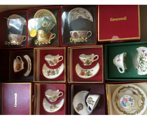 A large collection of miniature cups and saucers to include examples by Caverswall china, Coalport and Spode (qty).