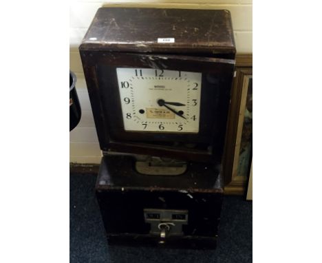 A National Time Recorder, circa 1950 with stained wood case, glazed door to reveal white square faced dial, overall height 70