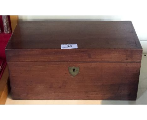 A Victorian mahogany tea caddy of rectangular form, the hinged cover lifts to enclose two lidded storage boxes and cut glass 