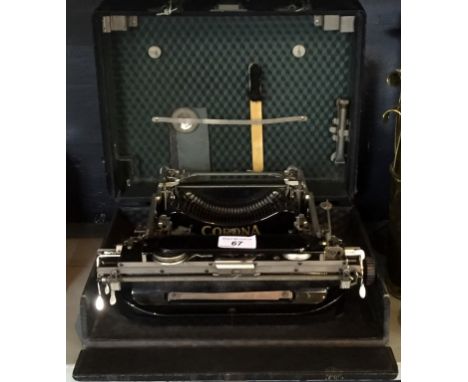 A cased vintage Corona typewriter.