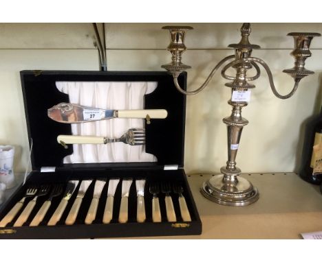 A modern silver-plated candelabra together with a silver-plated cased fish knives and fork set.