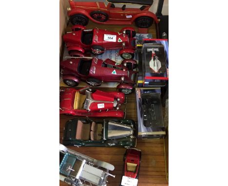 A collection of assorted vintage diecast models of classic cars.