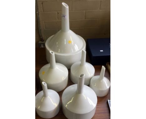 A collection of six Royal Worcester and Staatlich porcelain chemical measures of various sizes.