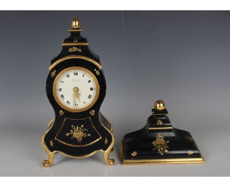 A mid-20th century Zenith ebonized mantel clock and bracket, the movement striking hours and half hours on a bell, the signed