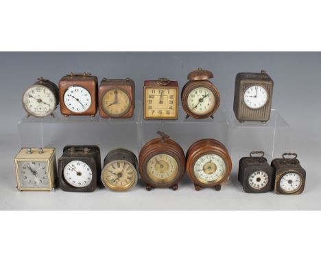 An early 20th century copper cased bedside alarm clock, the enamelled circular dial with Arabic hour numerals, the square cas