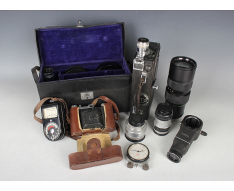 A collection of assorted cameras and accessories, including a Zeiss Ikon Contaflex, a Kodak 'Model K' cine camera, cased, thr
