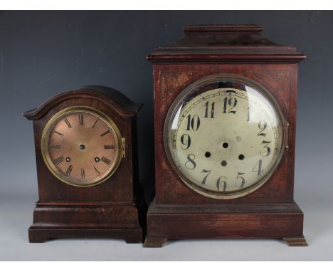 An early 20th century stained beech cased clock mantel with eight day movement striking on two gongs, the case with arched su