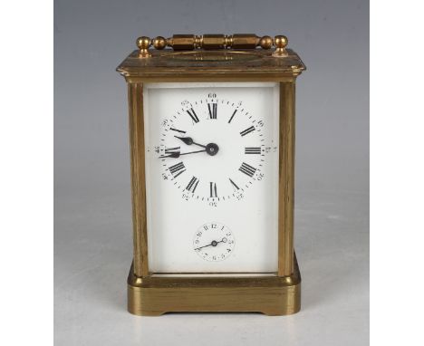 An early 20th century French lacquered brass carriage alarm clock with eight day movement striking on a bell, the enamelled d