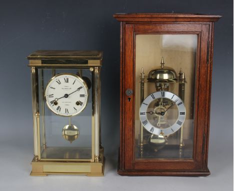 A late 20th century lacquered brass cased four glass mantel clock with eight day movement striking hours and half hours on a 