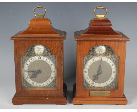 A 20th century mahogany mantel timepiece with Rotherhams movement, the brass breakarch dial with Roman hour numerals on a sil