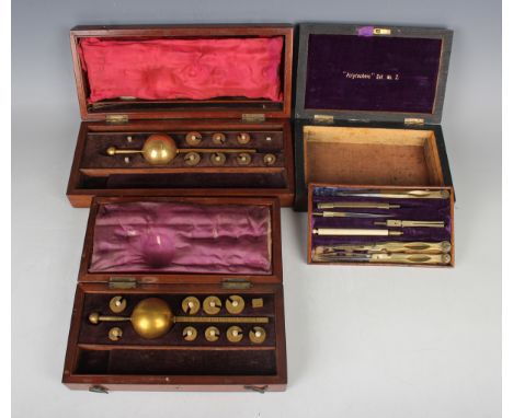 Two Victorian mahogany cased Sikes hydrometers, lengths 25cm and 20.2cm, and a rosewood cased drawing instrument set, length 