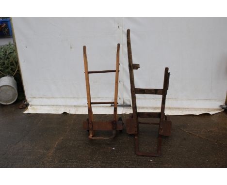 Two sets of vintage sack trucks. With cast iron wheels and bases, on wooden frames, one with one handle missing, H123cm.