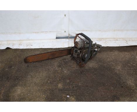 A vintage Danarm petrol powered chainsaw. Bar L57cm.