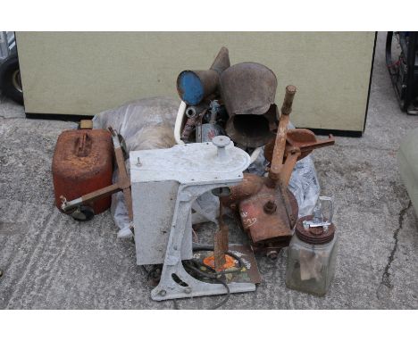 An assortment of vintage bygones. Including hessian sacks, oil cans etc.