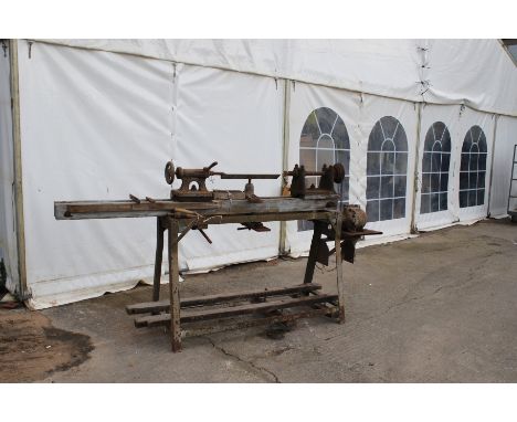 A vintage wood turning lathe. On a metal stand. L250cm x D59cm x H125cm