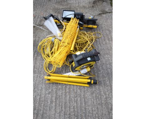 A quantity of 110v site lighting equipment. Including 110v extension reel, tripod stand and cables, etc.