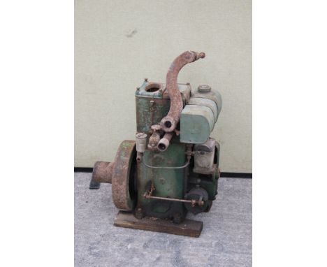 A Lister stationary engine. No. M162, in green, sold with Lister handle.
