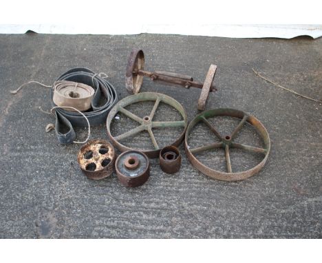 A collection of cast iron and stationary engine wheels. Comprising two sets of cast iron wheels (one with axle) and three sta