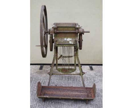A vintage cake kibbler and a galvanised feeding trough, H121cm.