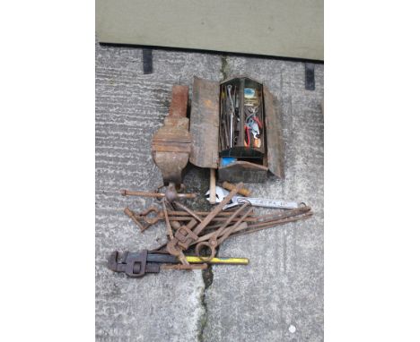 An assortment of tools and a Record vice. Noting wrenches and screwdrivers etc.