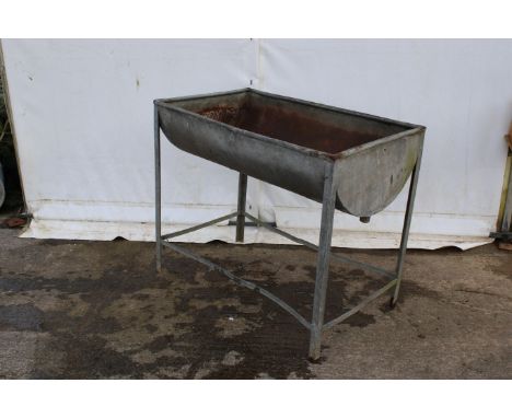 A galvanised metal wash stand and sink. H89cm x W103cm x D63cm.