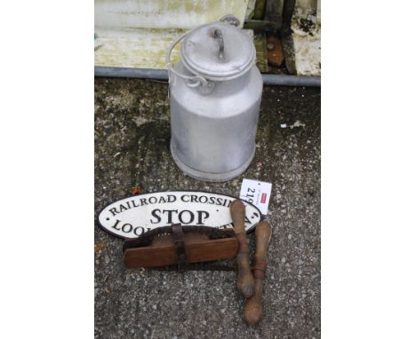 A collection of vintage bygones. Including a small galvanised milk churn, cast metal railroad sign and a vintage hand saw etc