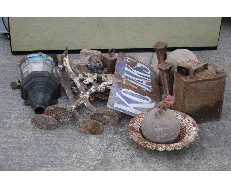 An assortment of vintage bygones. Including Kodaks enamel sign, cast metal bench ends, weights and oil can etc.
