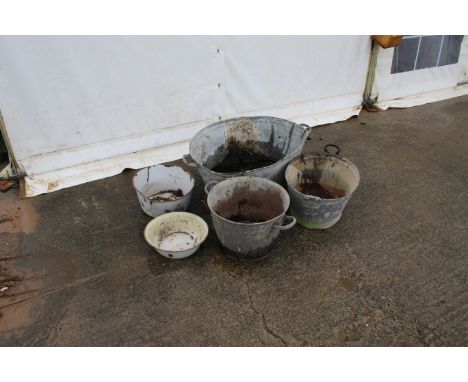 A collection of galvanised items. Comprising two vintage tin baths, two metal pots, etc. largest diameter 86cm, some watertig