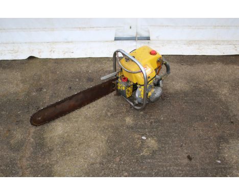 A Danarm petrol powered chainsaw. Finished in yellow, bar L57cm.