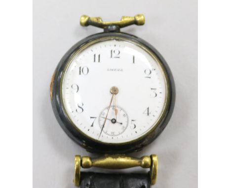 A gentleman's early 20th century gun metal Omega manual wind wrist watch, case numbered 3946677, (converted fob watch?)