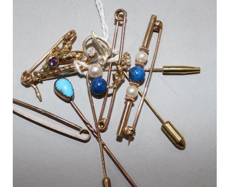A 9ct gold saxophone stick pin, a similar initial pin and tiepin and five various unmarked items, including a turquoise-set s