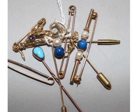 A 9ct gold saxophone stick pin, a similar initial pin and tiepin and five various unmarked items, including a turquoise-set s