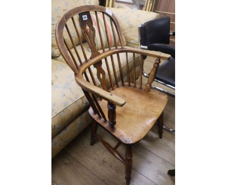 A 19th century ash and elm stick back elbow chair