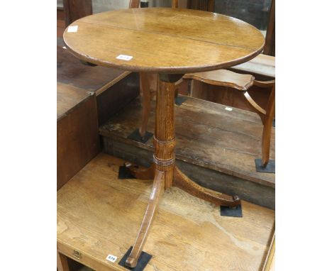 A Regency oak circular tilt top tripod table, H.69cm