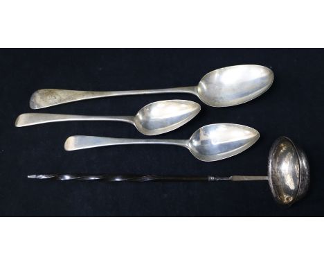 A Victorian silver basting spoon, two George III silver table spoons and a toddy ladle.