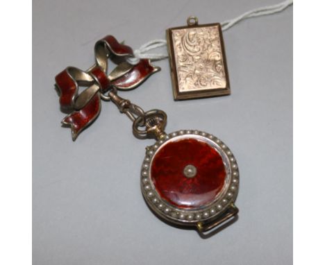 An early 20th century silver gilt & enamel fob watch with suspension brooch and a yellow metal locket.