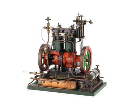 An Unusual Poppet Valve Steam Engine, the engine on a green painted base board, with enclosed crank case, spoked flywheels, w