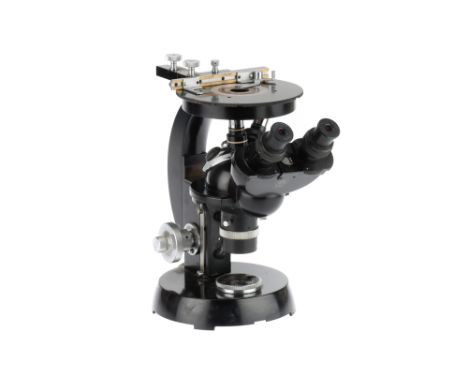 A Vintage Inverted Microscope by Carl Zeiss, German, c.1940, engraved 'CARL ZEISS 4291208. on circular base with mirror insid